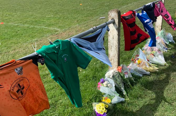 Clubs and people from the area have left shirts and flowers at Trethomas Bluebirds' pitch on Llanfabon Drive