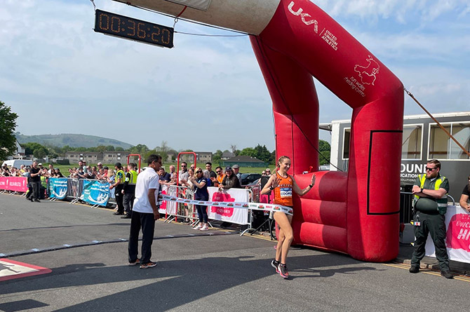Lauren Cooper crossing the finishing line