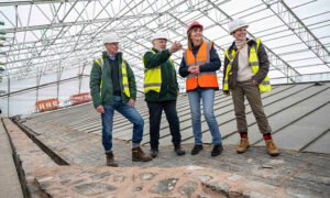 Culture secretary Lesley Griffiths, second from right, seeing the ongoing works at Caerphilly Castle