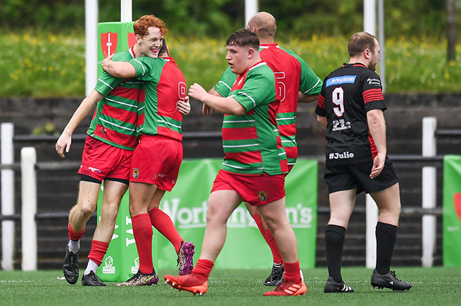 Deri's Tom Elliott is congratulated by his teammates after a try