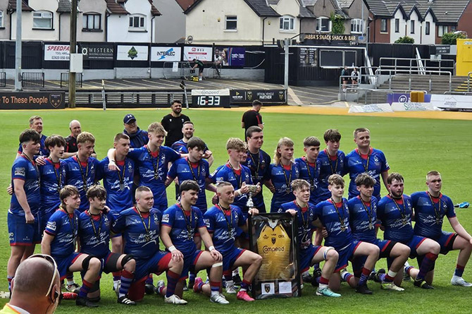 Senghenydd RFC's under-16s celebrate their Dragons Cup victory at Rodney Parade