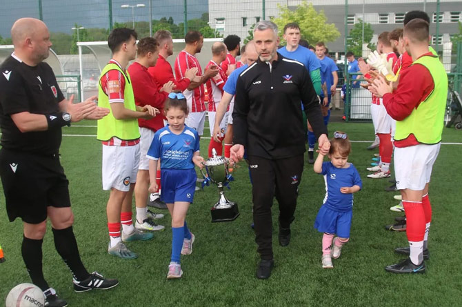 Bluebrids manager Mark Dunford with the league trophy 