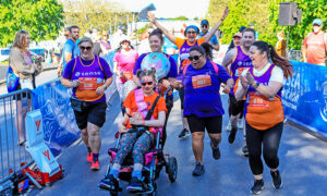 Izzy Wilshaw and the Sense team during the Gorseinon 10k