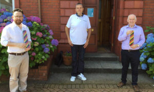 From left: Caerphilly MS Hefin David, infected blood victim Kirk Ellis, and former Caerphilly MP Wayne David
