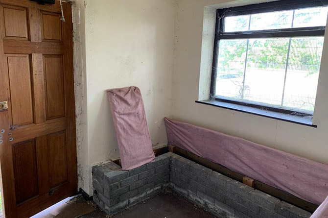 Inside the former taxi office building on Heol Aneurin