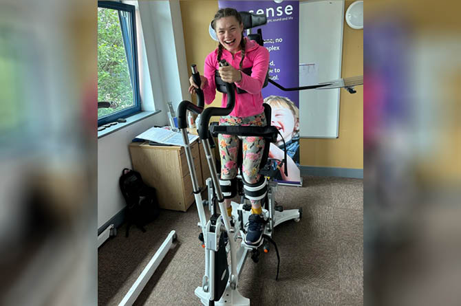 Izzy Wilshaw, 24, using the Innowalk at Touchbase