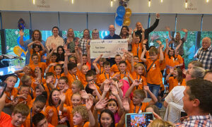 Twyn School pupils celebrating their £11,000 fundraising at Caerphilly's Ten Degrees restaurant