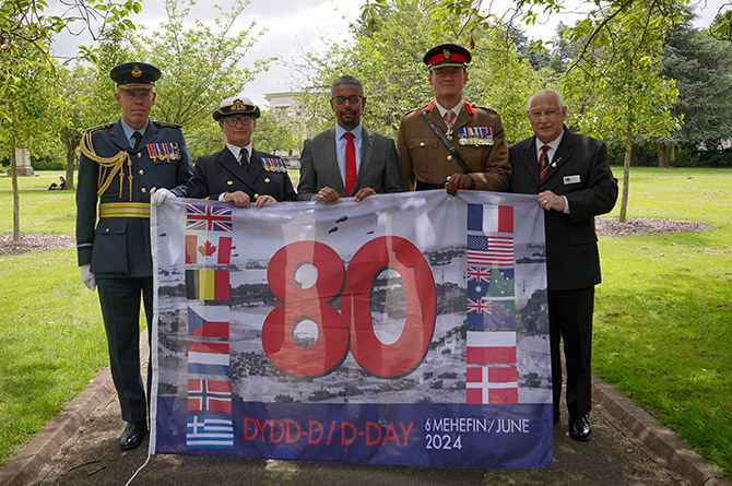 First Minister Vaughan Gething with representatives of the armed forces in Cardiff ahead of the 80th anniversary of D-Day