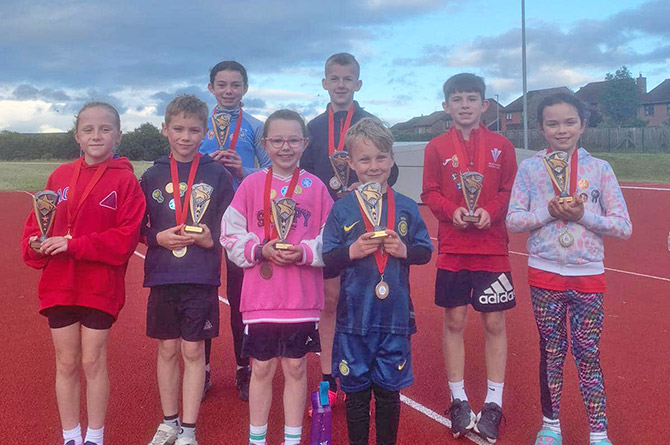 Some of the athletes with their awards
