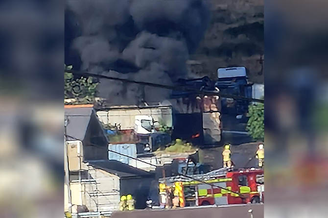 Fire crews extinguished a  large garage fire on Hill Street