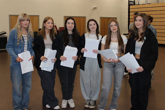 GCSE pupils at Islwyn High School receiving their grades