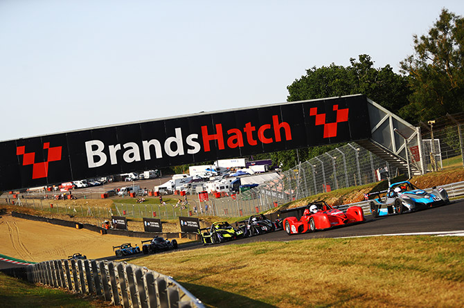 Graham Cole, in the red car and white helmet, at Brands Hatch