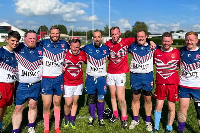 Wales and England players pose after last year's encounter in Llandovery