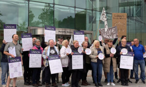 Unison members at Caerphilly County Borough Council protest outside the council offices on September 24