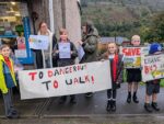 Pupils and parents protesting in Wattsville over proposed cuts to their school bus