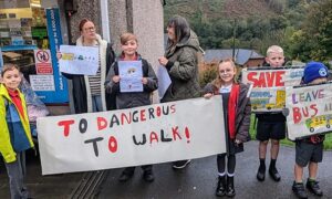 Pupils and parents protesting in Wattsville over proposed cuts to their school bus
