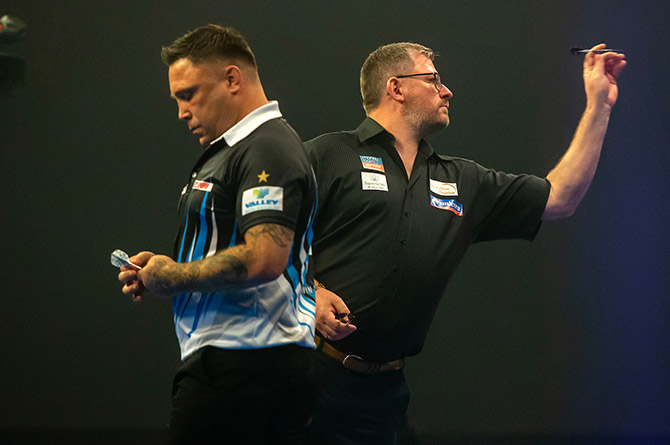 Gerwyn Price, left, during his defeat to James Wade