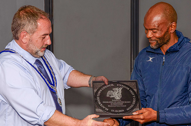 Blackwood town mayor Rhys Mills with Lesotho Rugby's Litsitso Motseremeli