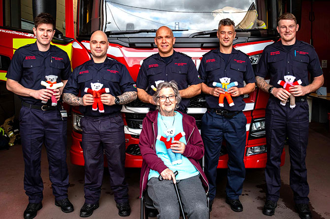 June with Caerphilly firefighters and her trauma teddies