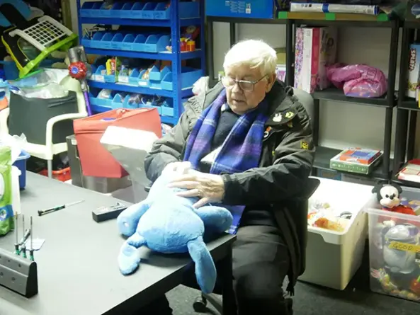 A volunteer helping sort toys at the Toy Box Project's Bedwas warehouse