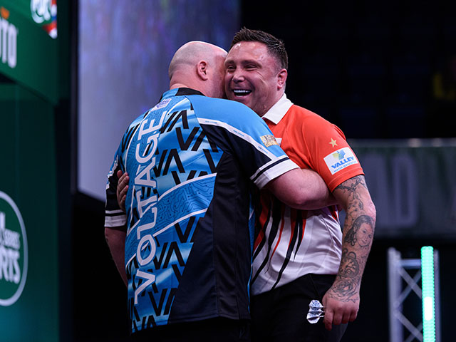 Gerwyn Price, right, with Rob Cross during the Dutch Darts Masters semi-finals