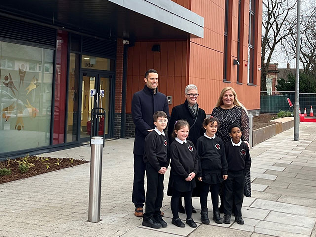 From left: Cllr Dimitri Batrouni, Cllr Deb Davies, and headteacher Jo Giles, with pupils, at the opening of the new building at St Andrews Primary School, Newport