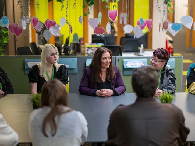 Vikki Howells MS, centre, speaking with students at Coleg y Cymoedd