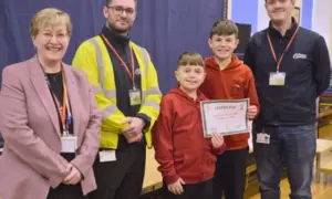 Cllr Carol Andrews, left, presenting a certificate to Crumlin High Level pupils