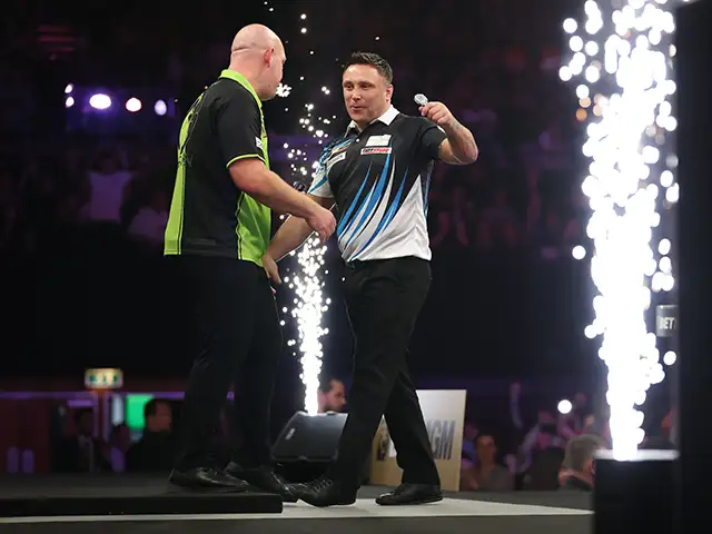 Gerwyn Price, right, with Michael van Gerwen during their quarter-final clash in Brighton