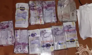 Cash seized by police during a series of raids across Caerphilly County Borough on March 11