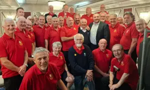 Aber Valley Male Voice Choir with Wales and Lions rugby stars Ken Owens and Liam Williams