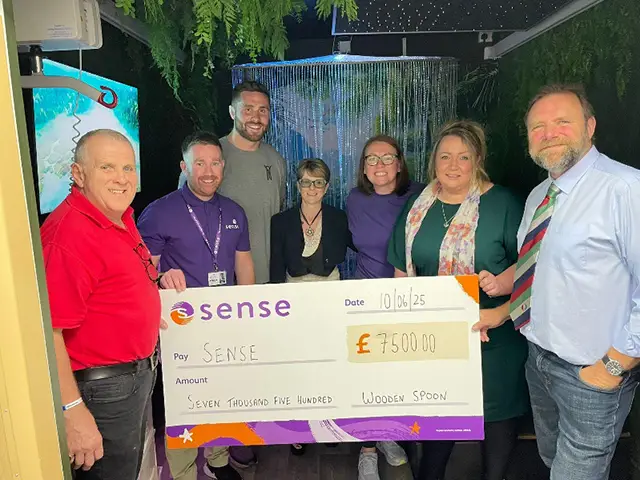 From left: Huw Thomas, chair of Wooden Spoon Wales; Owain Rees, regional fundraising manager for Sense in Wales; George Nott; Lucy Romain, operations manager for Sense in Wales; Kate Wright; Claire James and Anthony Evans, both from the Wooden Spoon Wales team