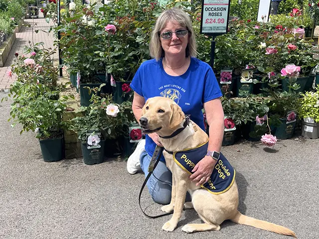 Sue Sims meeting nine-month old guide dog Flora