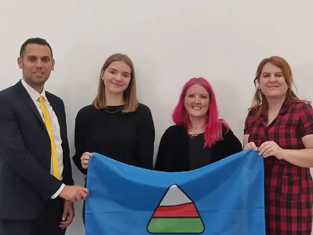 Cllr Dimitri Batrouni (left) and Cllr Emma Stowell-Corten (right) at an event to welcome Newport hosting the Eisteddfod yr Urdd 2027