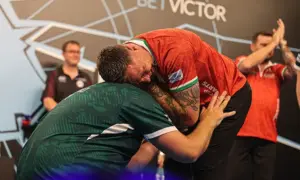 Gerwyn Price congratulates Daryl Gurney after he clinched victory for Northern Ireland in the final