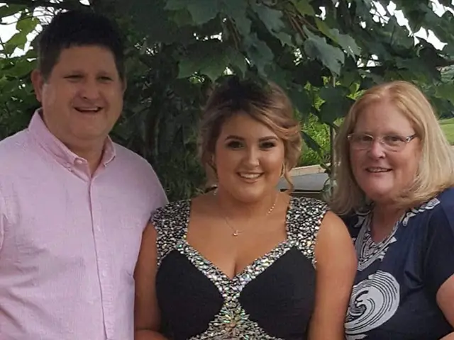 Lauren, centre, with dad Simon and mum Gemma