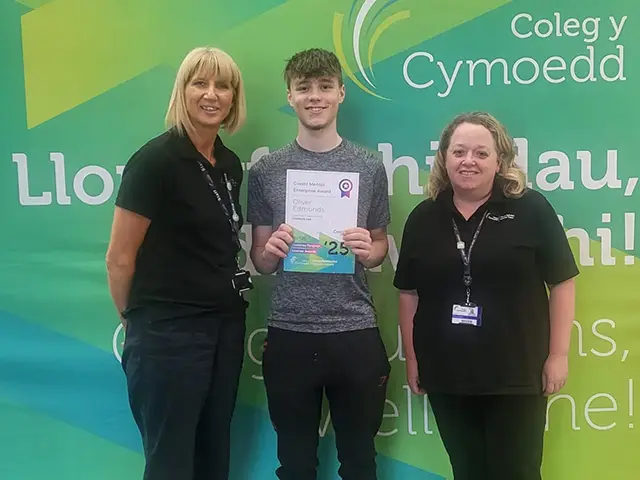 Oliver Edmunds receiving an enterprise award at Coleg y Cymoedd