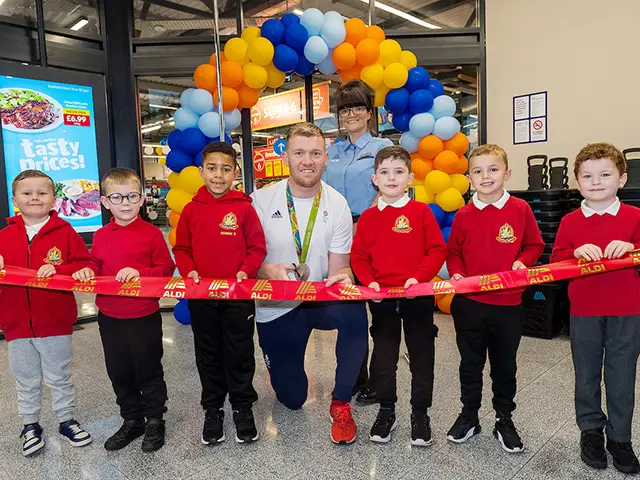 Llanfabon Infants' pupils were joined by Sam Cross to open the new Aldi in Nelson