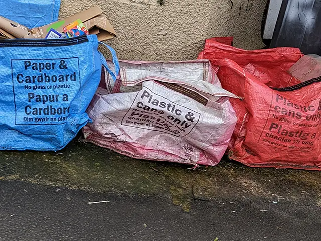 Recycling bags on a pavement in Newport