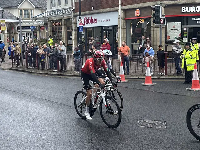Geraint Thomas (in red) in Caerphilly town centre on his final race before retirement