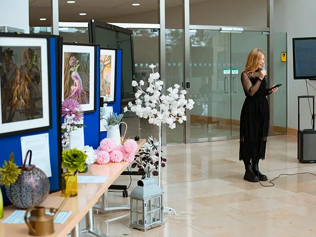 Olesia Miftahova speaking at the event