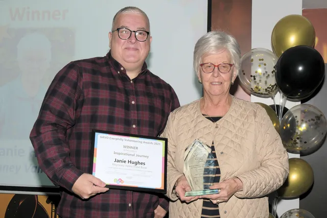 Janie Hughes, of Rhymney Valley Food Bank, receiving the Inspirational Journey award from United Welsh' Justin Ball