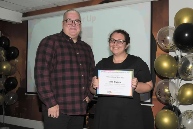Elise Brydon, of Caerphilly Miners' Centre's Glowyr Bach, receiving the Inspirational Journey runner-up award from United Welsh' Justin Ball