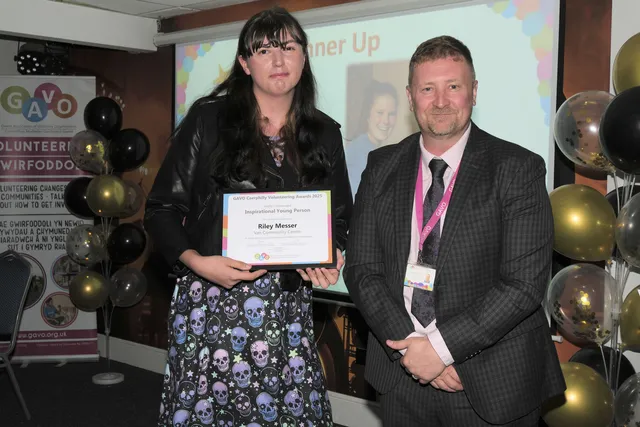Riley Messer, of Van Community Centre, receiving her Inspirational Young Person award from GAVO CEO Stephen Tiley