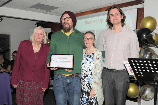 James Green, of Bute Energy, right, presenting the Environmental runner-up award to members of Morgan Jones Allotments