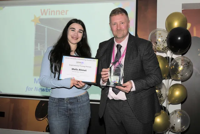 Melis Ahmet is presented with her Inspiration Young Person award by GAVO CEO Stephen Tiley