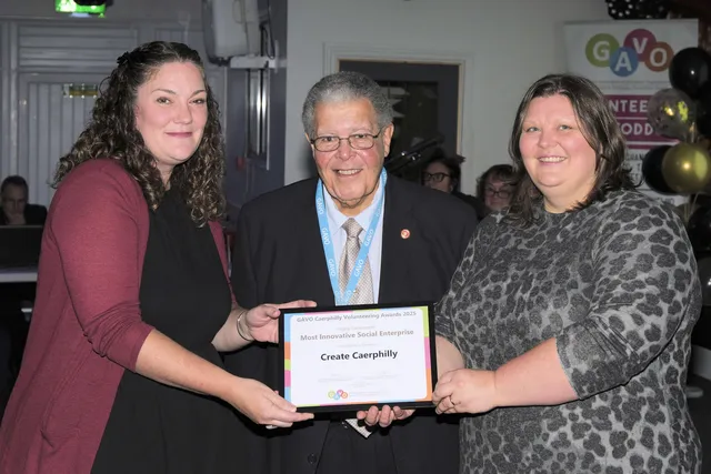 Sally Morgan and Claire Donnelly of Create Caerphilly receive their runners-up award from GAVO's Edward Watts