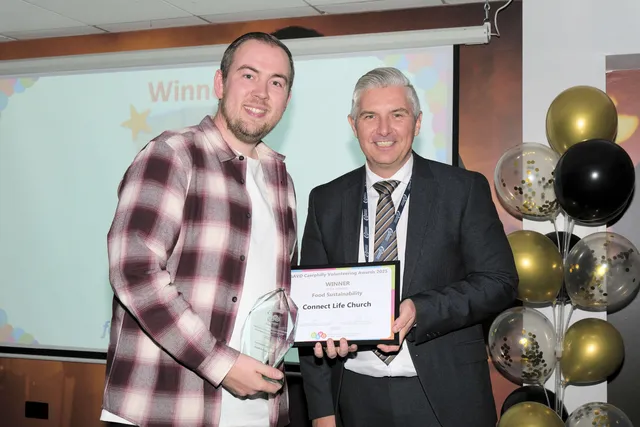 Ryan Hyde, of Connect Life Church, receives the Food Sustanability award from Caerphilly Council chief executive Richard Edmunds