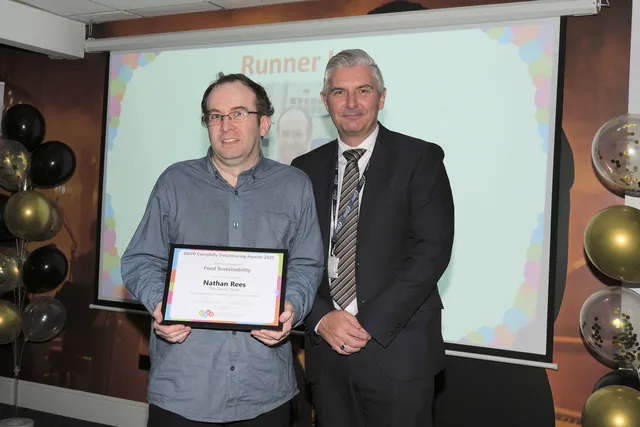 Nathan Rees, of the Parish Trust, is presented with his Food Sustainability runner-up award from Caerphilly Council chief executive Richard Edmunds