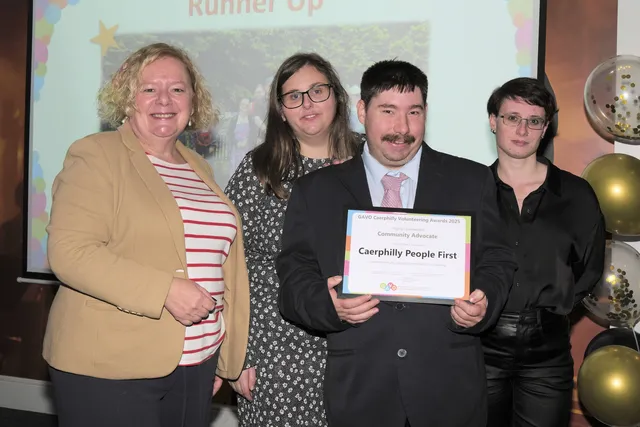 Gwent Police and Crime Commissioner, Jane Mudd, left, presents the Community Advocate runner-up award to Ffion Poole, Amy Jones, and Gethin Chamberlain from Caerphilly People First